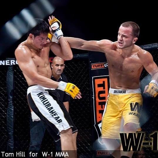Dino competing in W-1 MMA